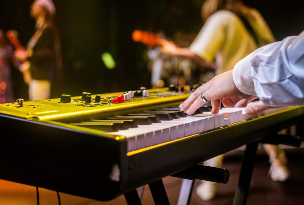 a close up of a person playing a keyboard